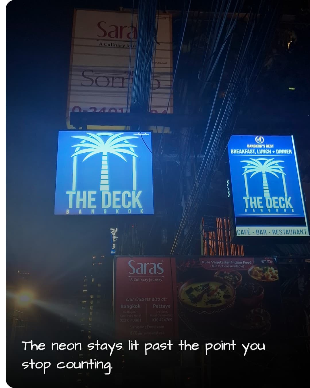 The Deck Bangkok neon sign at night